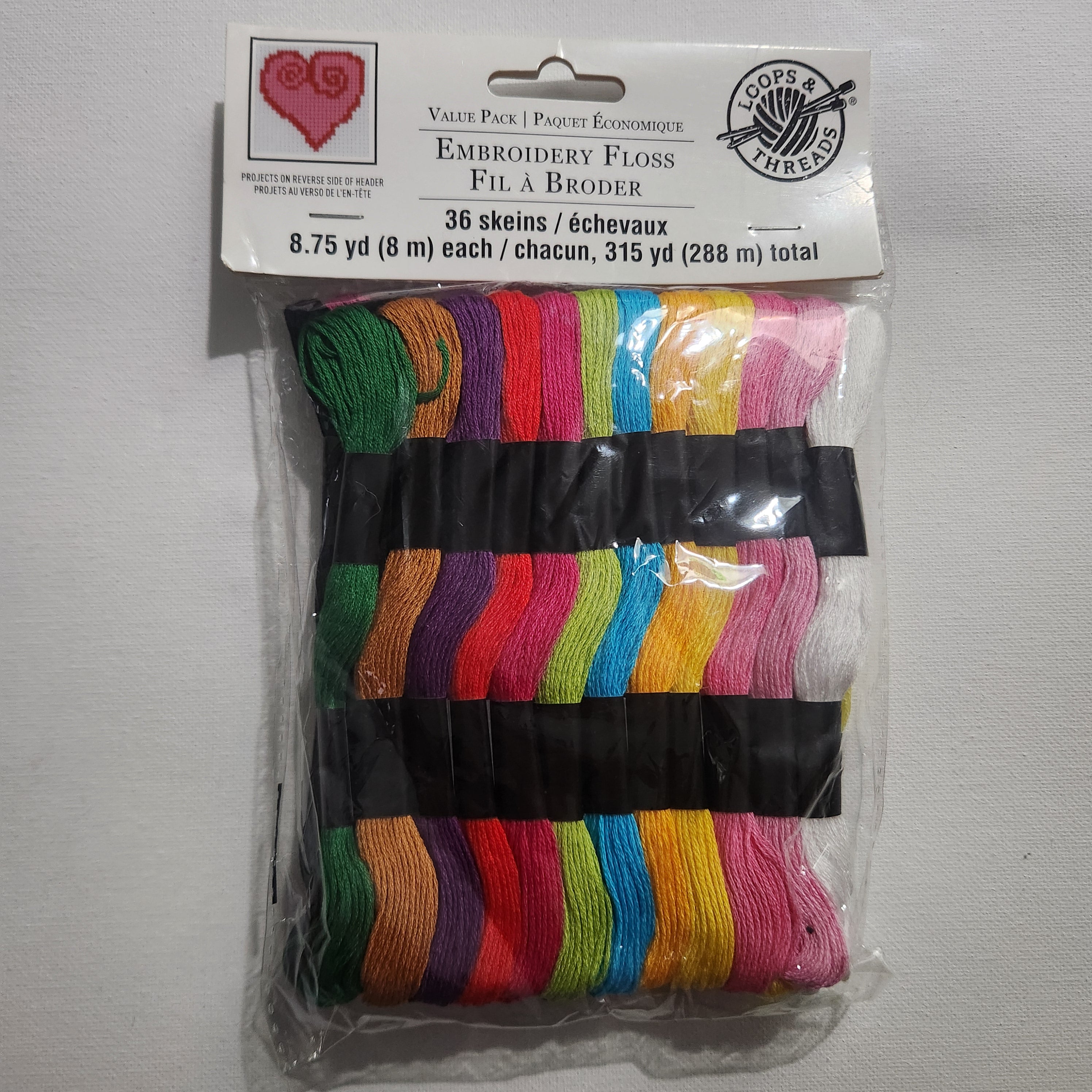 Packaged embroidery floss with colorful skeins and a label on a white background